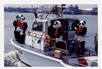 U.S. Coast Guard Auxiliary safety mascots wearing life jackets